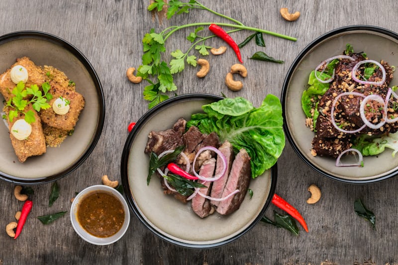 Colourful food spread on a wooden table